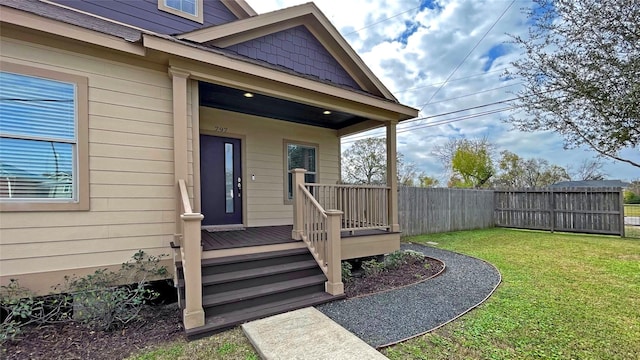 property entrance featuring a lawn