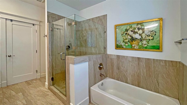 bathroom with separate shower and tub