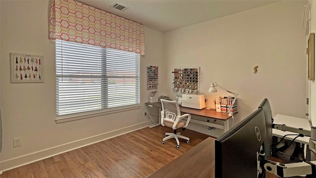 home office with hardwood / wood-style flooring