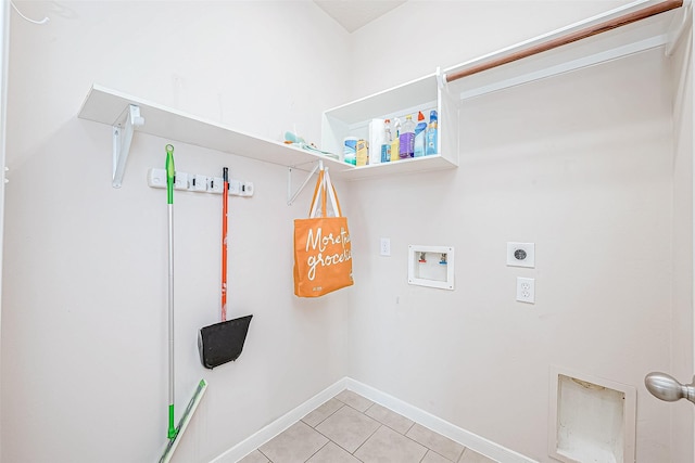 laundry area featuring washer hookup, light tile patterned flooring, and hookup for an electric dryer