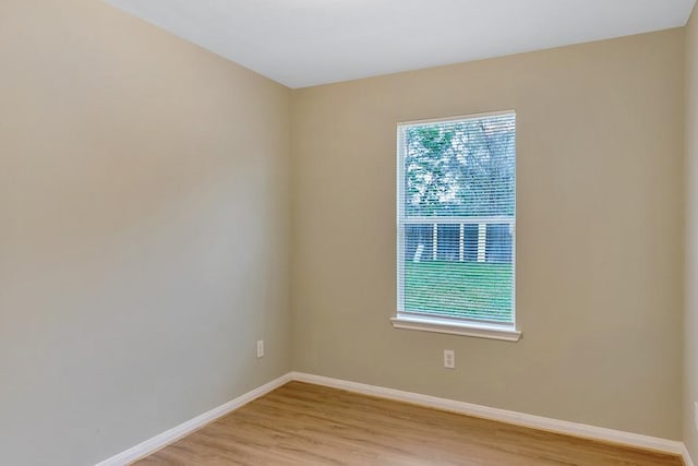 spare room with light wood-type flooring