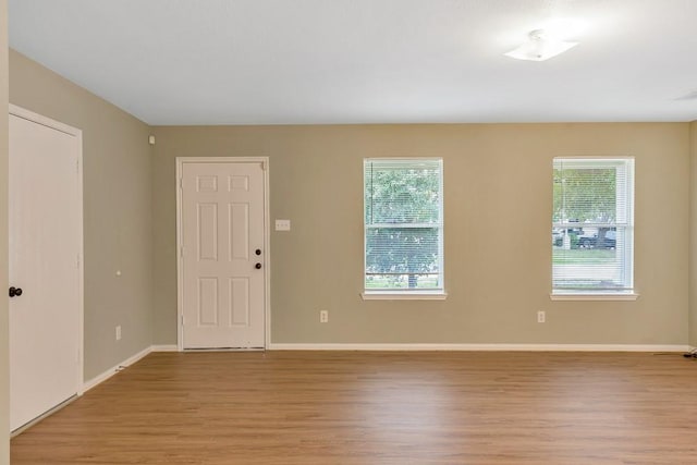 unfurnished room featuring light hardwood / wood-style flooring