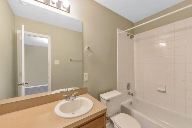 full bathroom with vanity, toilet, and tiled shower / bath