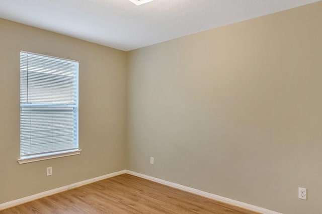 unfurnished room with light hardwood / wood-style flooring