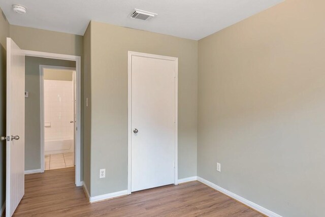 unfurnished bedroom featuring light hardwood / wood-style flooring