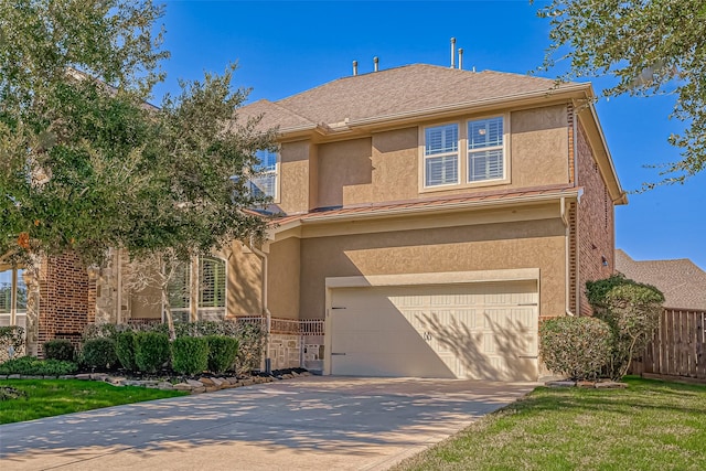 view of front of home featuring a front lawn and a garage