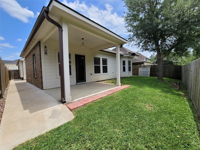 back of property featuring a patio and a lawn