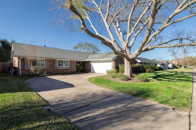 single story home with a front yard and a garage