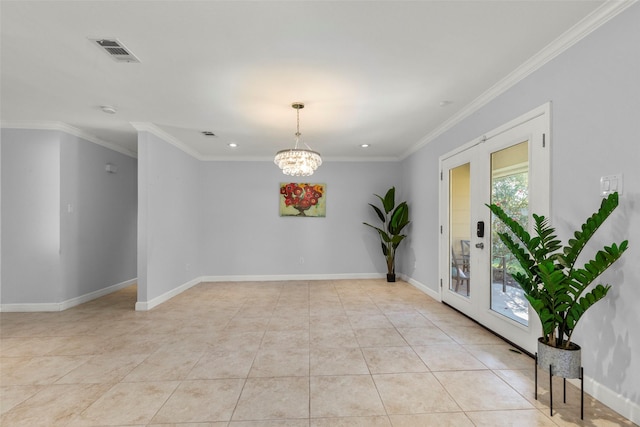 empty room with a chandelier, plenty of natural light, ornamental molding, and french doors