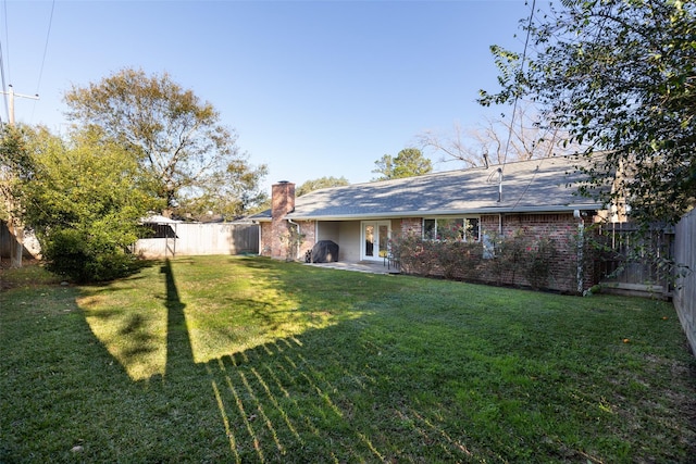 view of yard featuring french doors