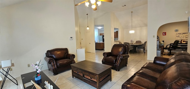 tiled living room featuring high vaulted ceiling and ceiling fan