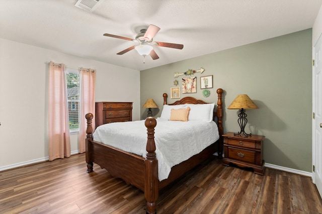 bedroom featuring ceiling fan and dark wood-type flooring