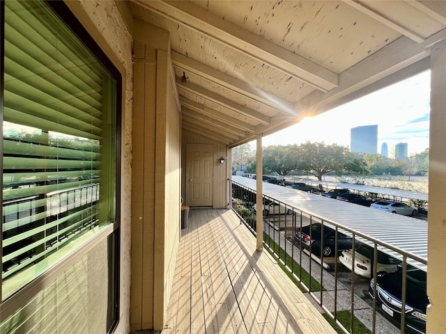 balcony featuring a water view and a view of city