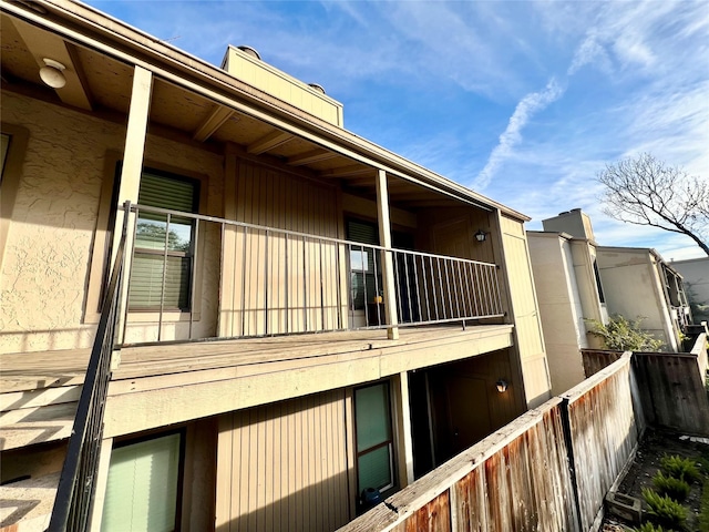 view of side of property with a balcony