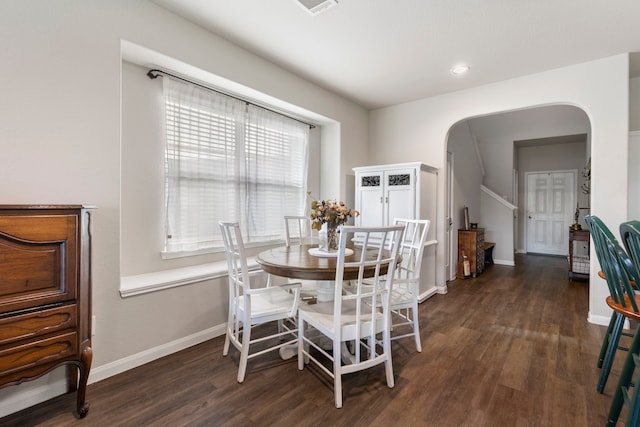 dining space featuring dark hardwood / wood-style floors