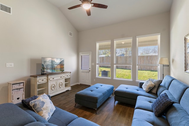 living room featuring ceiling fan, dark wood-type flooring, and lofted ceiling