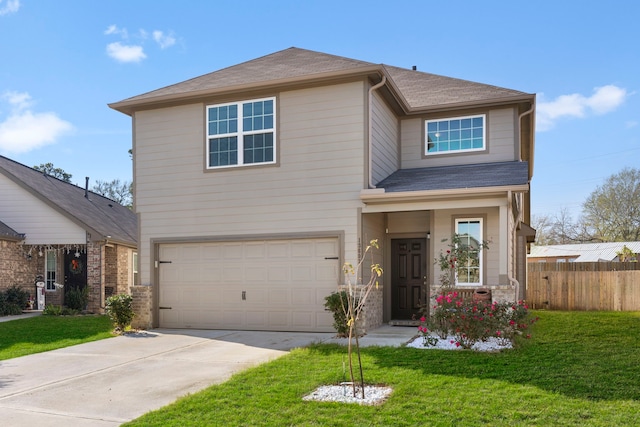 view of front of house featuring a garage and a front lawn