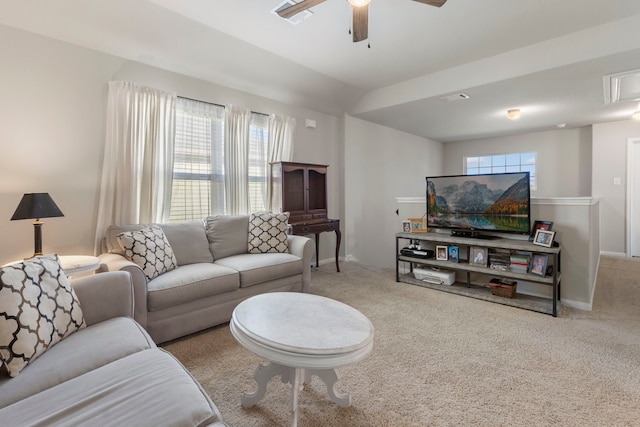 carpeted living room with ceiling fan