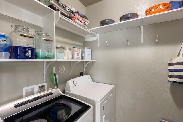 washroom with independent washer and dryer