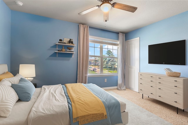 bedroom featuring light carpet and ceiling fan