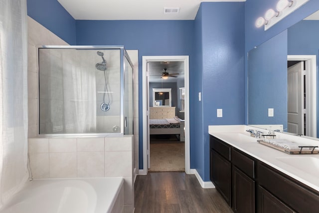 bathroom with separate shower and tub, ceiling fan, vanity, and hardwood / wood-style flooring