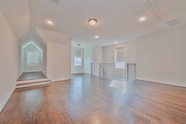 additional living space featuring hardwood / wood-style flooring