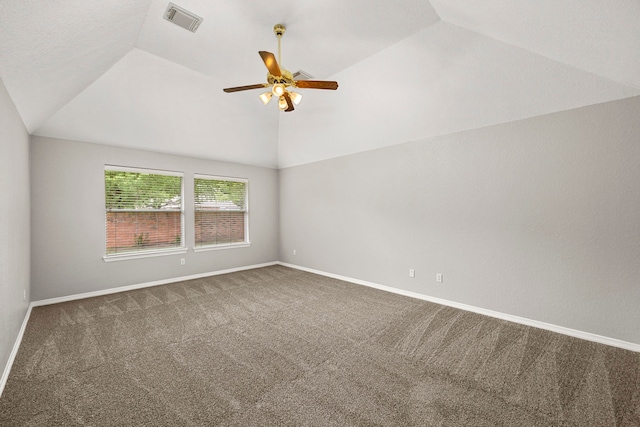 unfurnished room with carpet floors, vaulted ceiling, and ceiling fan