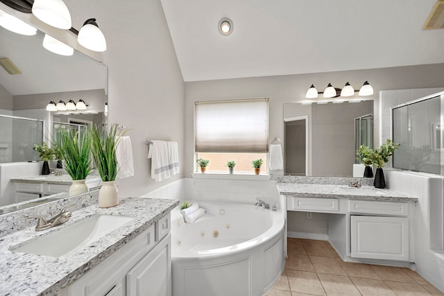 bathroom featuring tile patterned flooring, vanity, separate shower and tub, and lofted ceiling