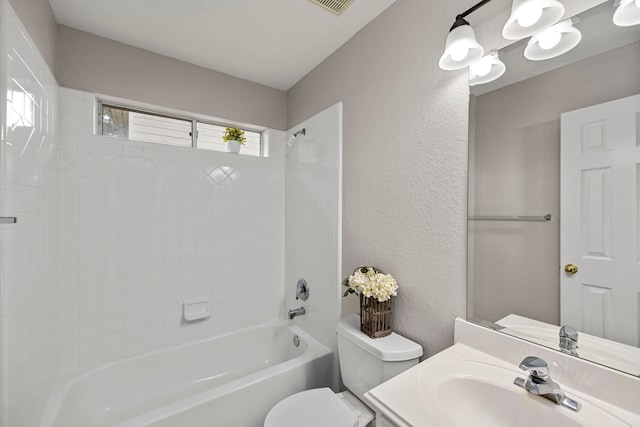 full bathroom featuring vanity, shower / bathtub combination, and toilet