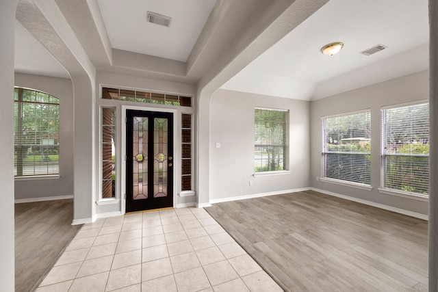 entryway featuring light tile patterned flooring