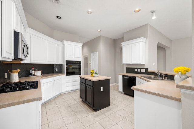 kitchen featuring kitchen peninsula, sink, black appliances, white cabinets, and a center island