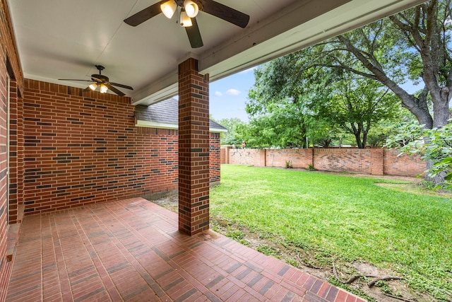 exterior space featuring ceiling fan