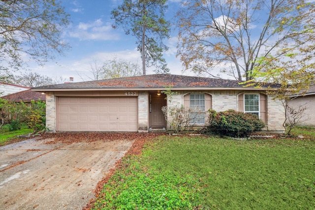 single story home with a front yard and a garage