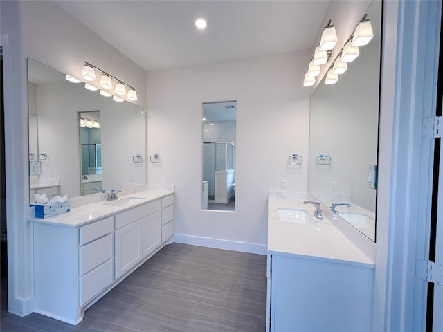 bathroom with vanity and an enclosed shower