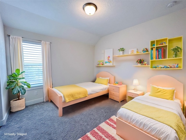 carpeted bedroom featuring a textured ceiling and vaulted ceiling