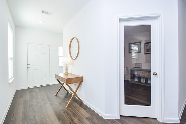 foyer entrance featuring dark hardwood / wood-style floors