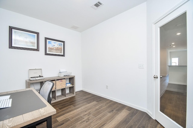 office with dark hardwood / wood-style floors