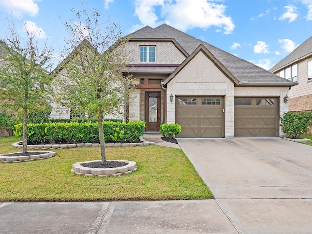 view of front facade featuring a front lawn and a garage