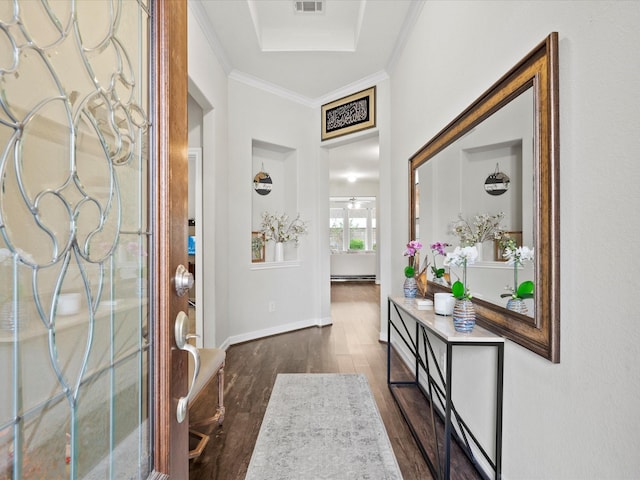 foyer with dark hardwood / wood-style floors and crown molding