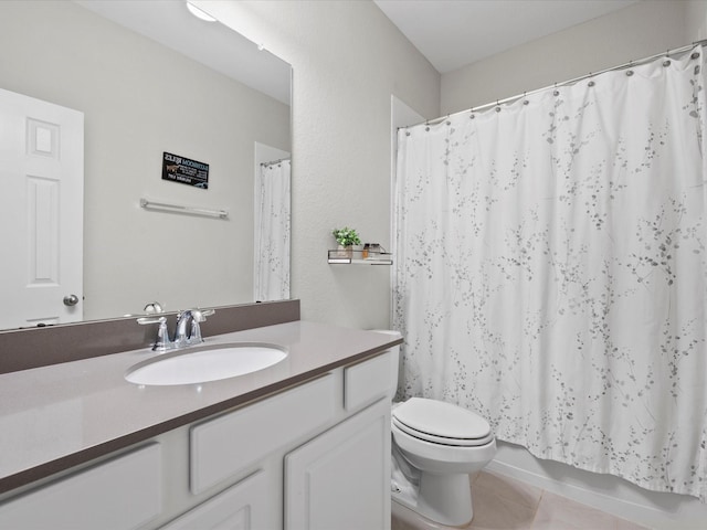 full bathroom with tile patterned flooring, shower / bath combo, vanity, and toilet