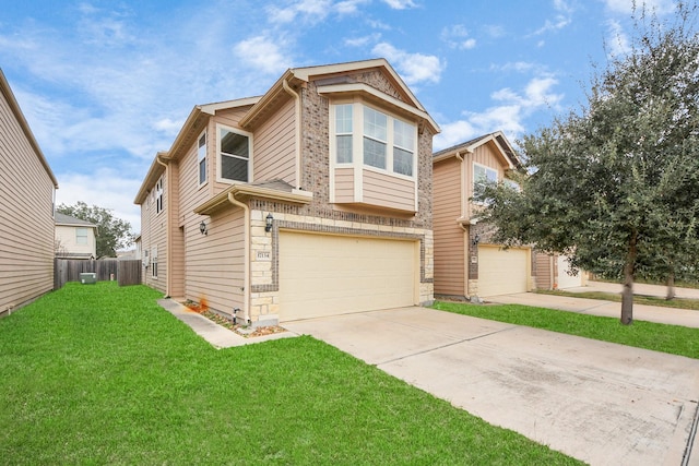 view of front facade featuring a garage and a front lawn