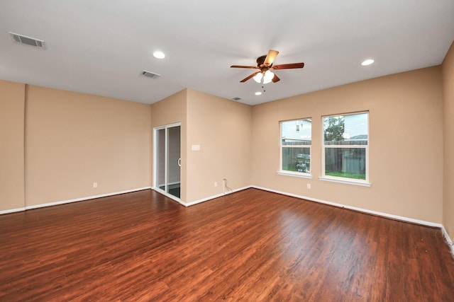 empty room featuring dark hardwood / wood-style floors and ceiling fan