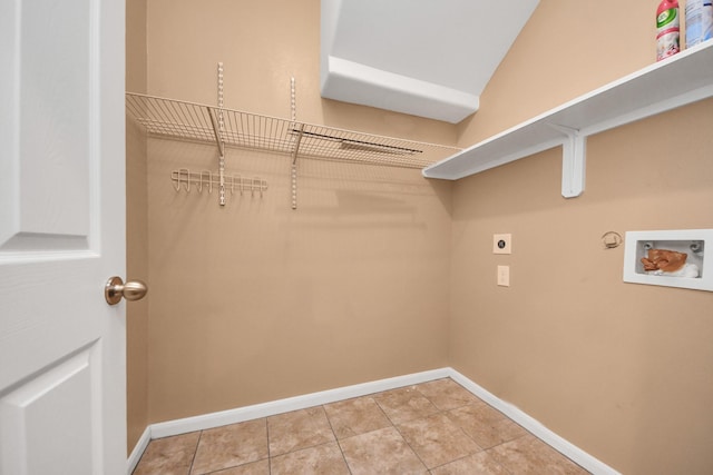 laundry area featuring washer hookup, hookup for a gas dryer, light tile patterned floors, and electric dryer hookup