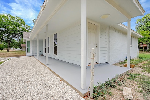 view of side of property with a porch