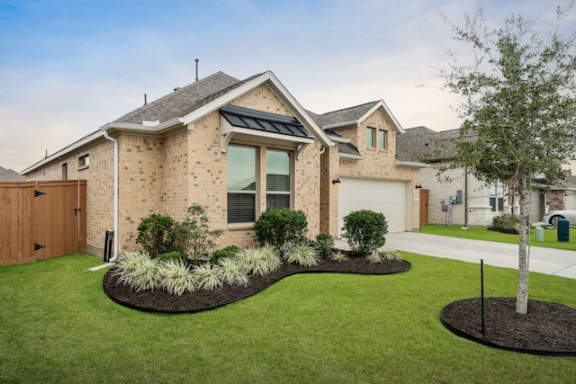 view of front of property featuring a lawn and a garage