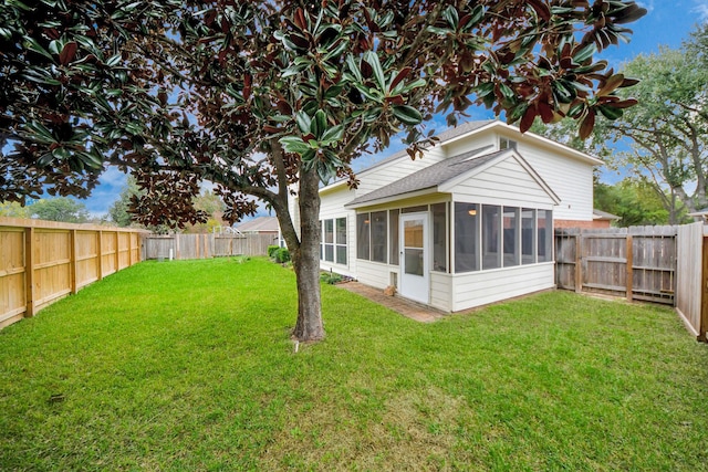 view of yard with a sunroom