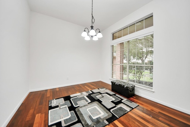 interior space with dark hardwood / wood-style flooring and a chandelier