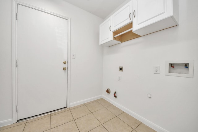 laundry room with light tile patterned floors, cabinets, washer hookup, hookup for a gas dryer, and hookup for an electric dryer