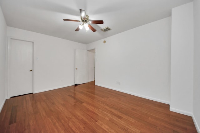 empty room featuring wood-type flooring and ceiling fan