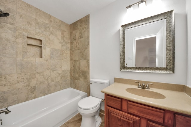 full bathroom with tile patterned floors, toilet, tiled shower / bath combo, and vanity